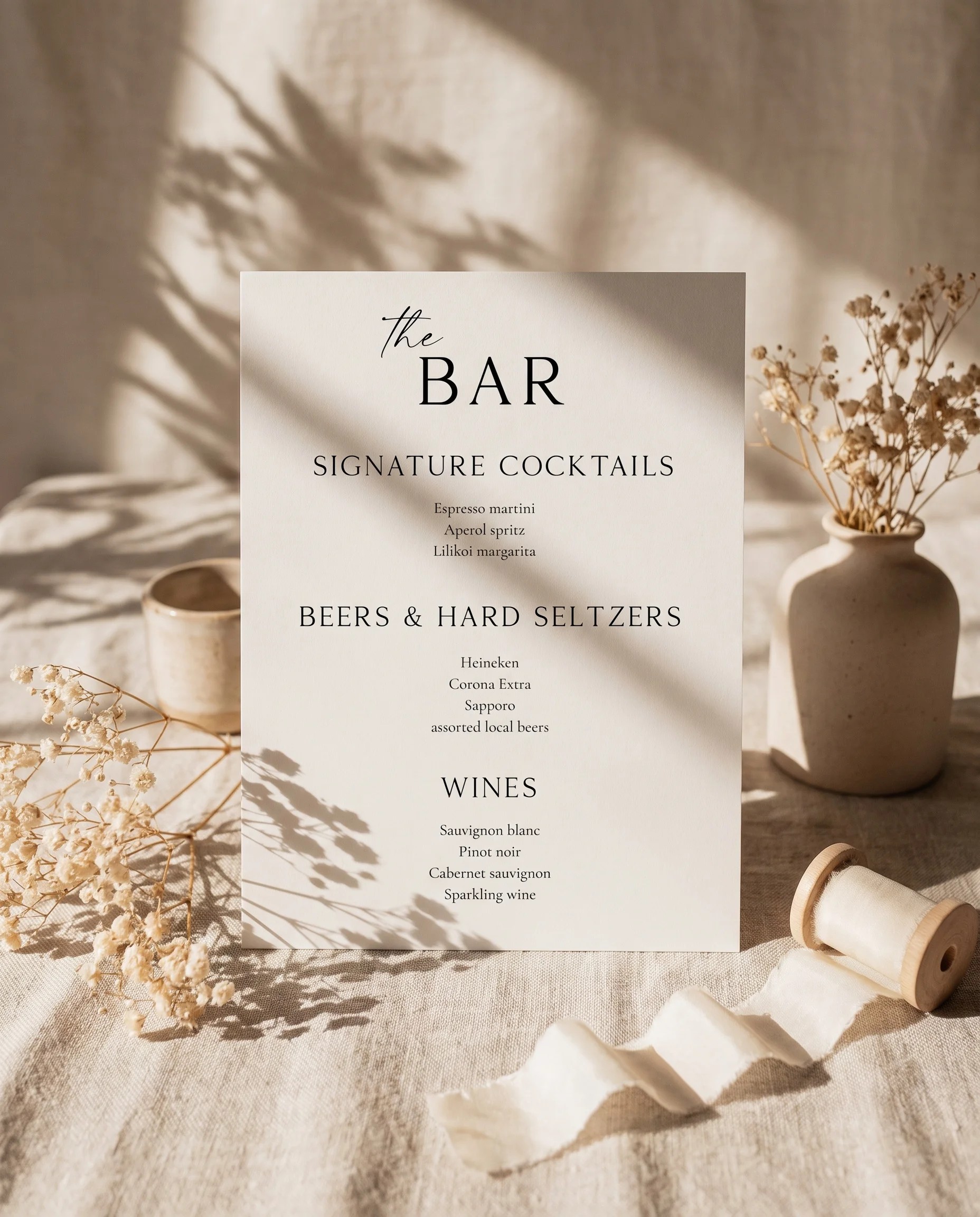 Sunlit — bar menu displayed upright in a styled setting under soft natural light at a slight overhead angle, wedding bar sign.